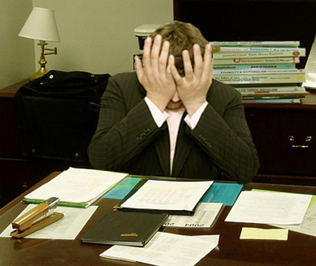 Frustrated_man_at_a_desk_(cropped).jpg